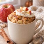Cinnamon apple protein mug cake topped with Greek yogurt and diced apple