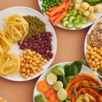 Plates of fiber-rich foods: beans, chickpeas, lentils, peas, vegetables, nuts and seeds
